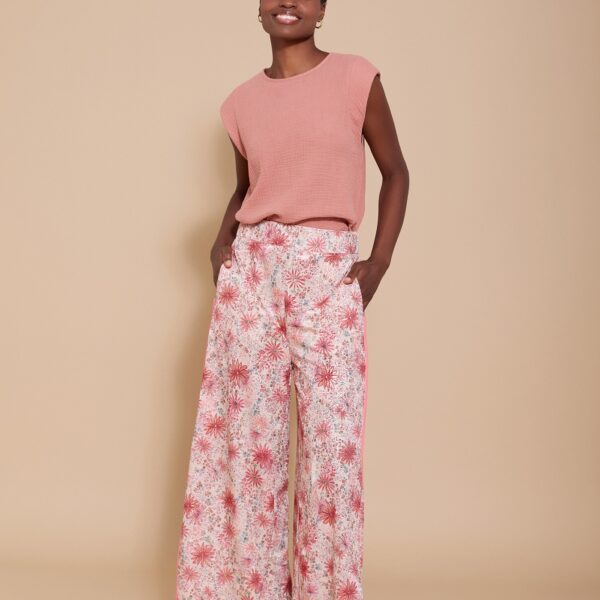 Pantalón fluido en tejido de punto. estampado floral. bajo cruzado con detalle dorado. WM05P129HYP